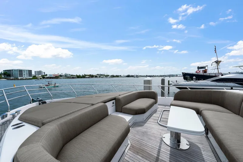 Slide: The Image of Luxurious 2020 Azimut Fly 78 yacht deck with elegant seating and scenic waterfront view. - 10