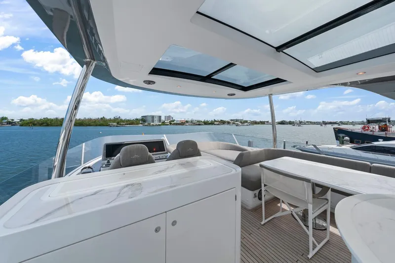 Slide: The Image of Luxurious 2020 Azimut Fly 78 yacht deck with seating, overlooking serene waters. - 39