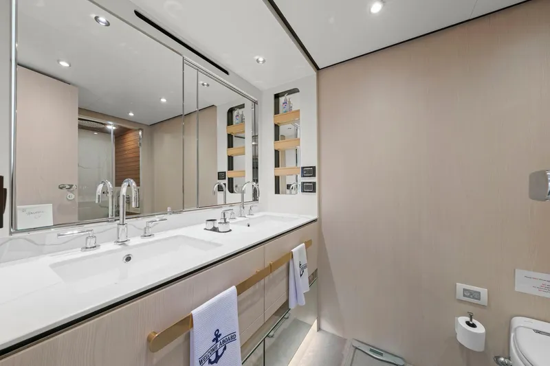 Slide: The Image of Luxurious bathroom in 2020 Azimut Fly 78 yacht with dual sinks and modern fixtures. - 79
