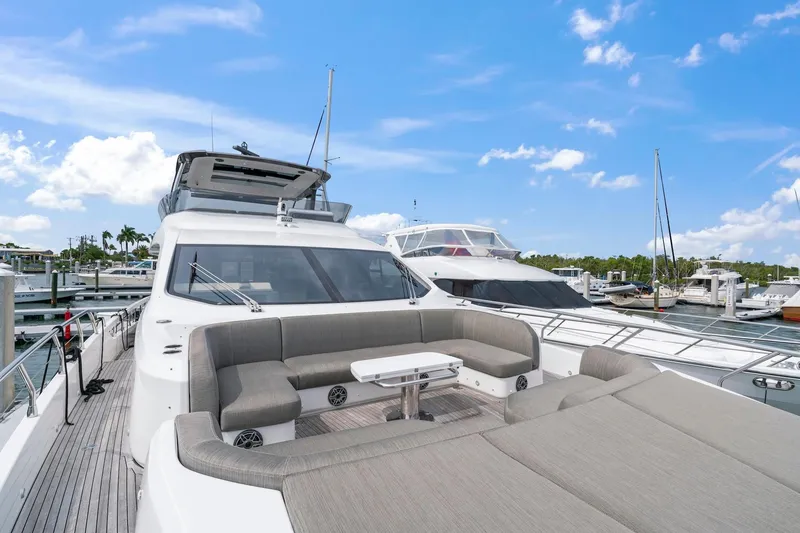 Slide: The Image of Azimut Fly 78 yacht, 2020 model, docked with spacious outdoor seating area. - 3