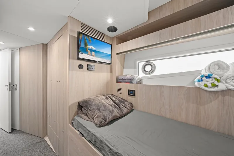 Slide: The Image of Luxurious cabin interior of 2020 Azimut Fly 78 yacht with cozy bedding and modern amenities. - 15