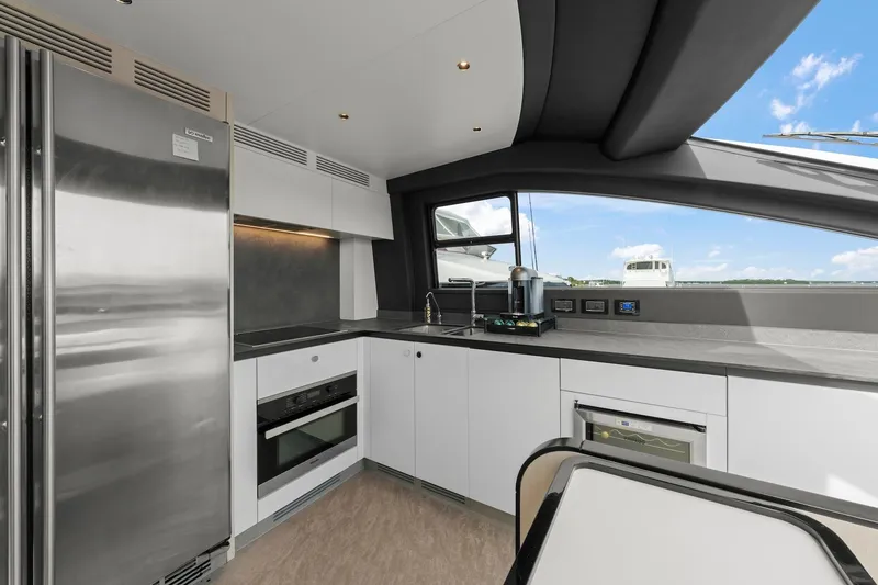 Slide: The Image of Modern kitchen interior on 2020 Azimut Fly 78 yacht with sleek appliances and ocean view. - 49