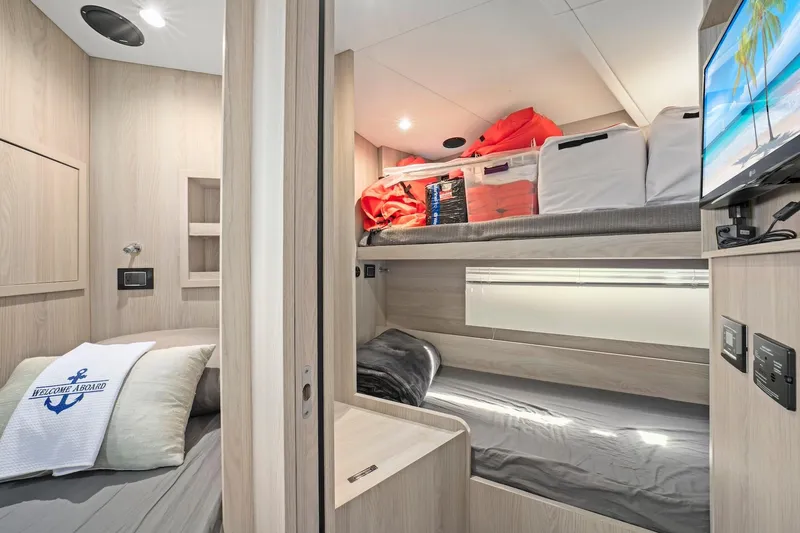 Slide: The Image of Luxurious cabin interior of 2020 Azimut Fly 78 yacht with modern amenities and cozy bedding. - 12
