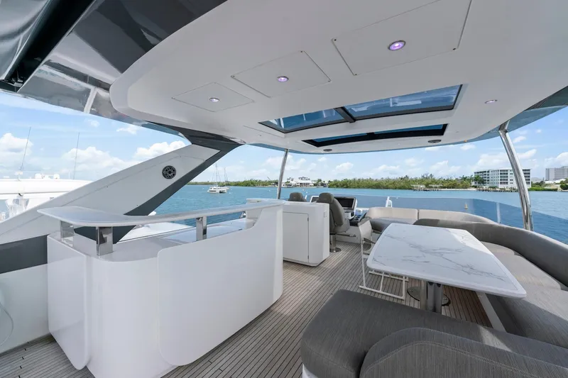 Slide: The Image of Luxurious 2020 Azimut Fly 78 yacht flybridge with modern seating and ocean view. - 22