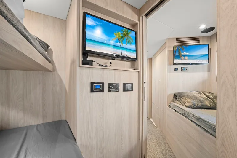Slide: The Image of Interior of 2020 Azimut Fly 78 yacht with modern wood finish and twin TVs. - 16