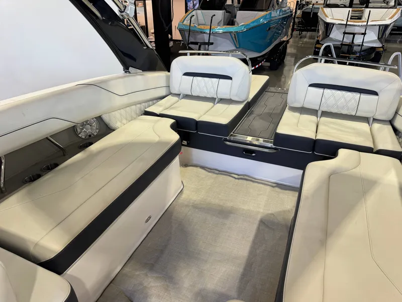 Slide: The Image of Interior of a 2020 Regal LS6 Surf with sleek, cream-colored seating and modern design. - 15