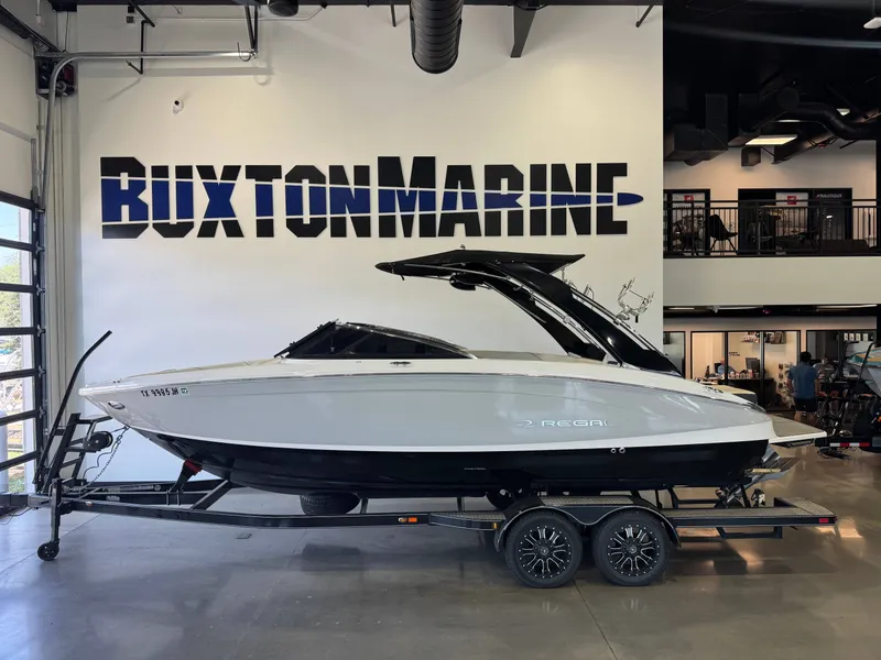 The Image of 2020 Regal LS6 Surf in a showroom on a trailer. - 1