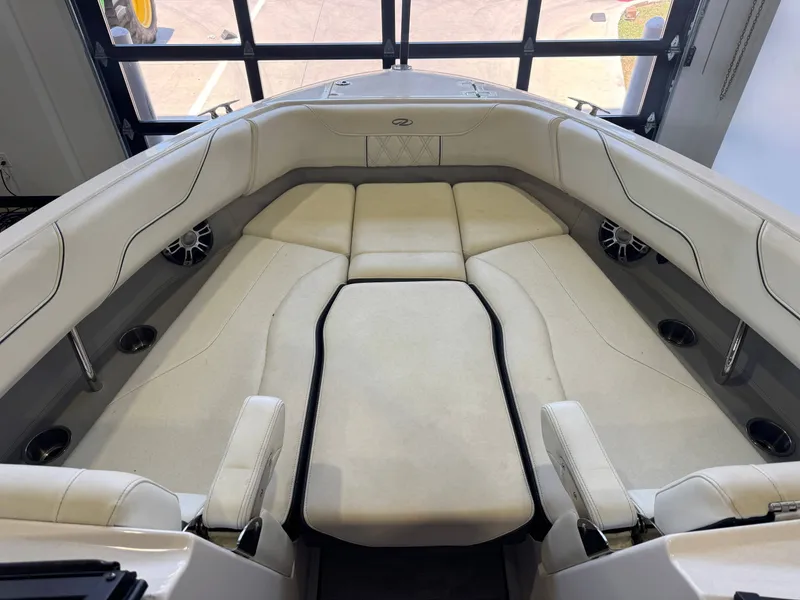 Slide: The Image of Interior view of a 2020 Regal LS6 Surf with beige upholstery and speakers. - 17