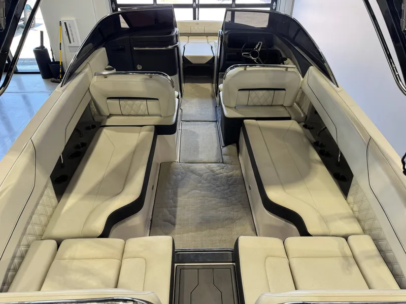 Slide: The Image of Interior view of a 2020 Regal LS6 Surf boat with beige upholstery and modern design. - 13