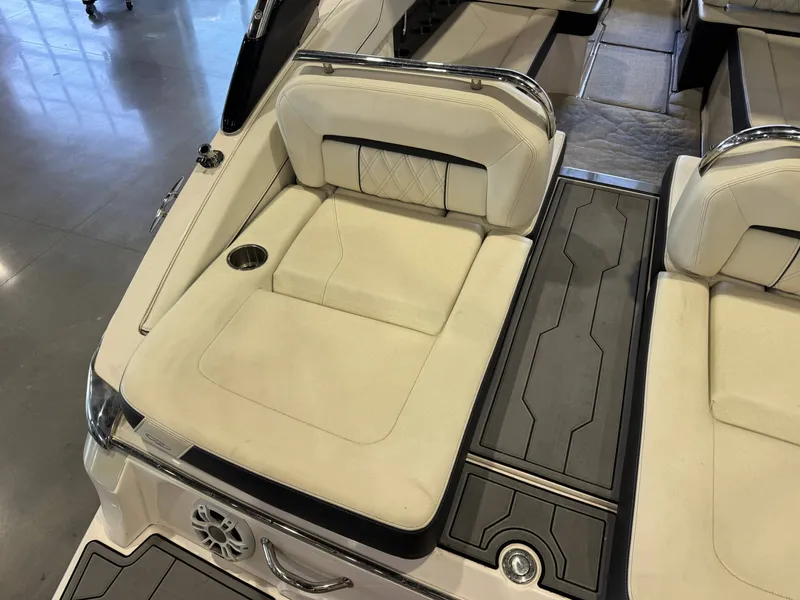 Slide: The Image of The image shows the stern of a 2020 Regal LS6 Surf boat with beige upholstery. - 12