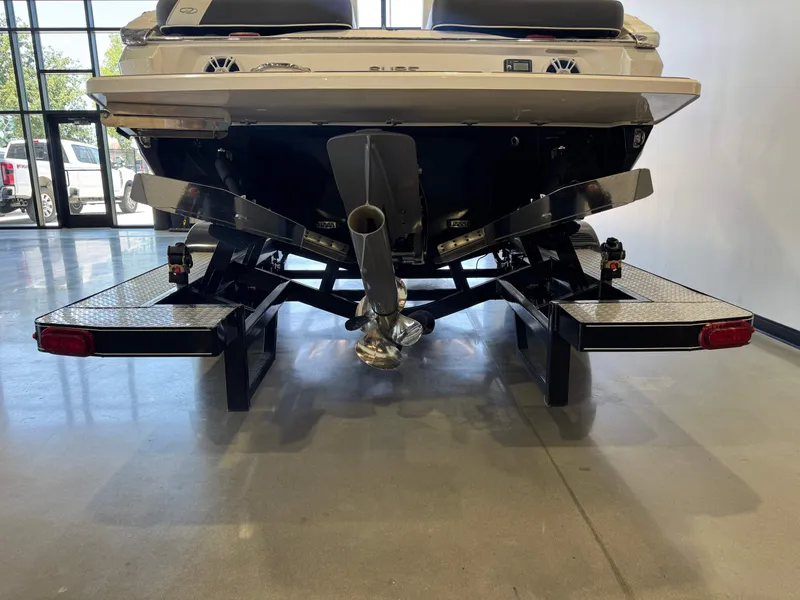 Slide: The Image of The image shows the rear of a 2020 Regal LS6 Surf boat with dual exhausts. - 7