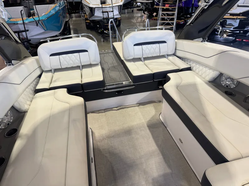 Slide: The Image of Interior view of a 2020 Regal LS6 Surf boat with luxurious white seating. - 16