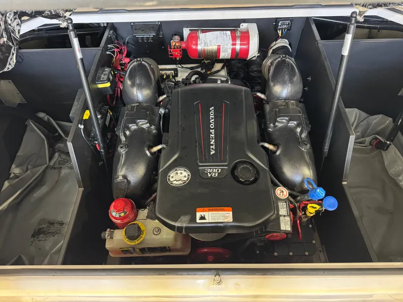 Slide: The Image of A Volvo Penta V8 engine in a 2020 Regal LS6 Surf boat, with fire extinguisher and accessories. - 26