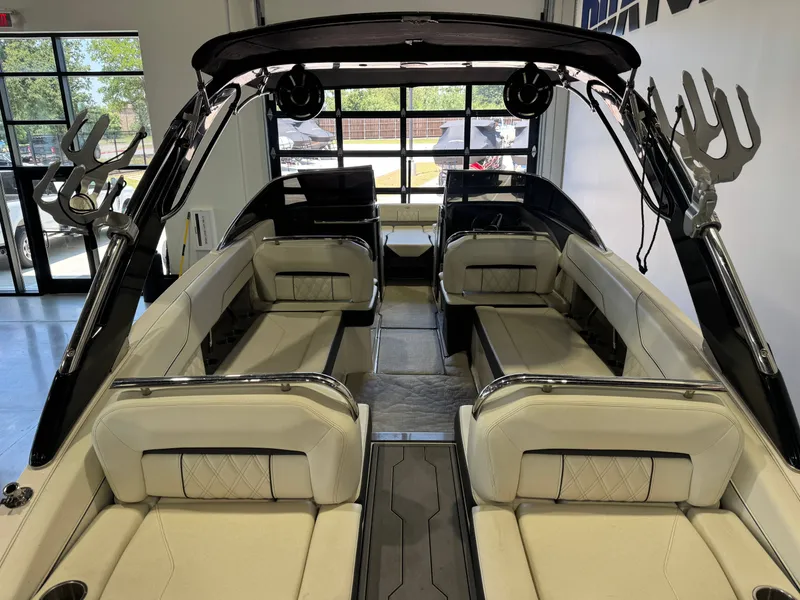 Slide: The Image of Interior view of a 2020 Regal LS6 Surf with sleek cream-colored seating and modern design. - 9