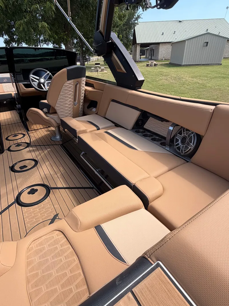 Slide: The Image of The image shows the interior of a 2025 MasterCraft X24 with luxurious beige seating. - 7