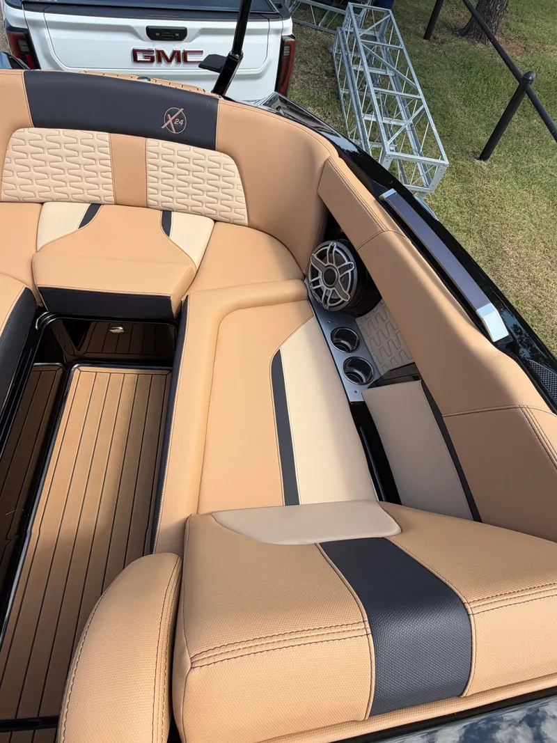 Slide: The Image of 2025 MasterCraft X24 featuring luxurious padded seating and modern speakers. - 12