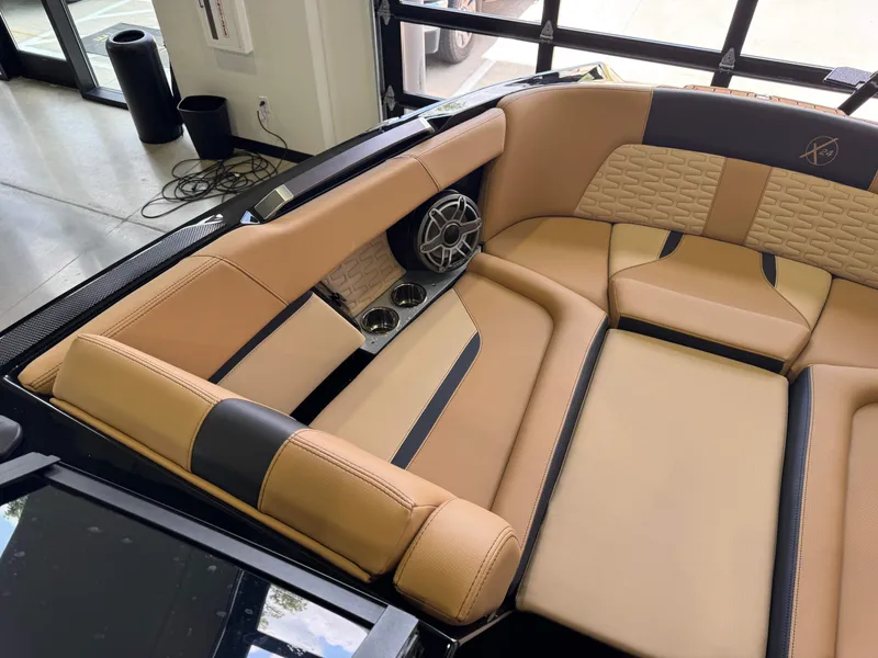 Slide: The Image of The image shows the luxurious interior of a 2025 MasterCraft X24 with beige upholstery. - 21