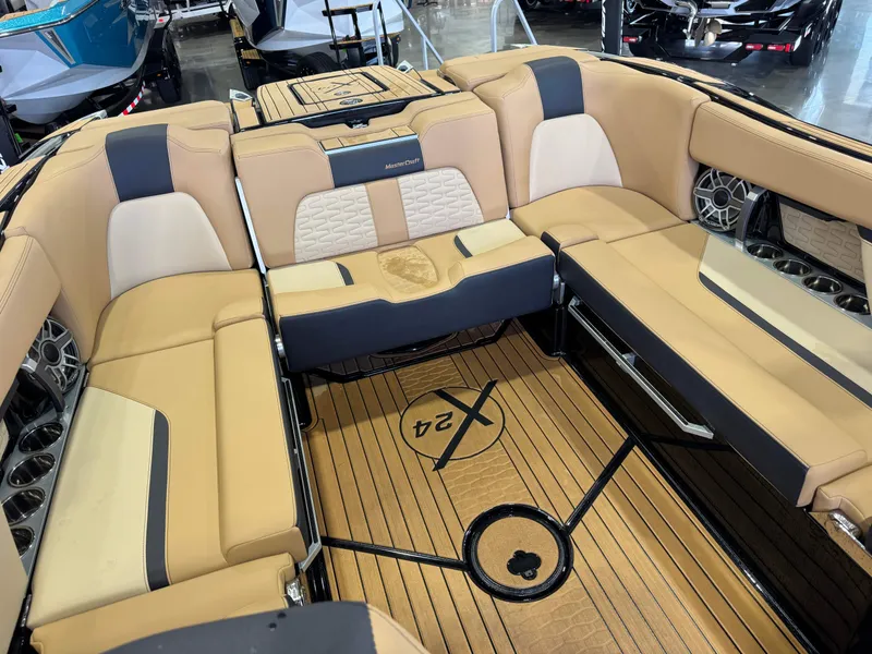Slide: The Image of The image shows the luxurious interior of a 2025 MasterCraft X24 with elegant seating. - 18