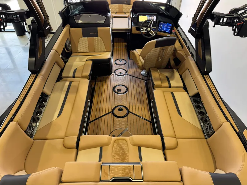 Slide: The Image of The image shows the luxurious interior of a 2025 MasterCraft X24 boat with elegant leather seating. - 15