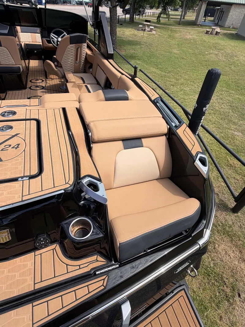 Slide: The Image of The image shows the luxurious interior of a 2025 MasterCraft X24 boat with beige seating. - 4