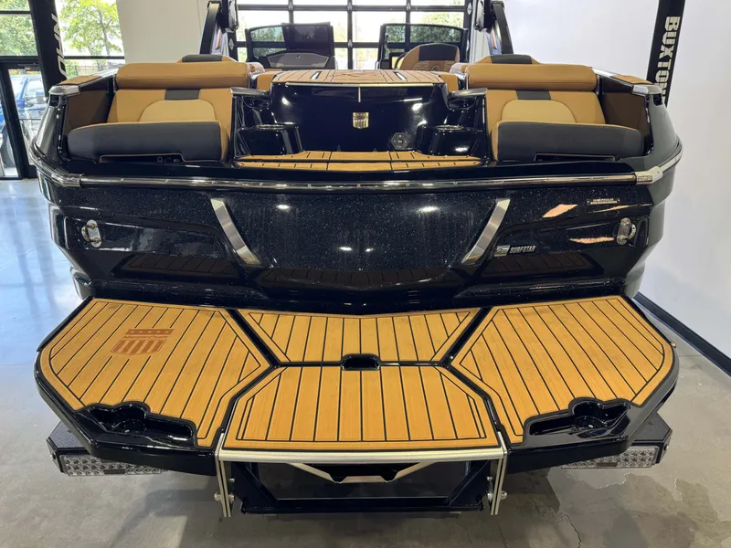 Slide: The Image of The image shows the rear of a 2025 MasterCraft X24 with sleek wood accents. - 8