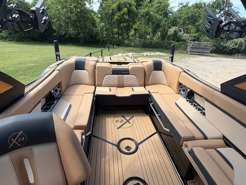 Slide: The Image of 2025 MasterCraft X24: Luxurious interior with beige upholstery and sleek details. - 10