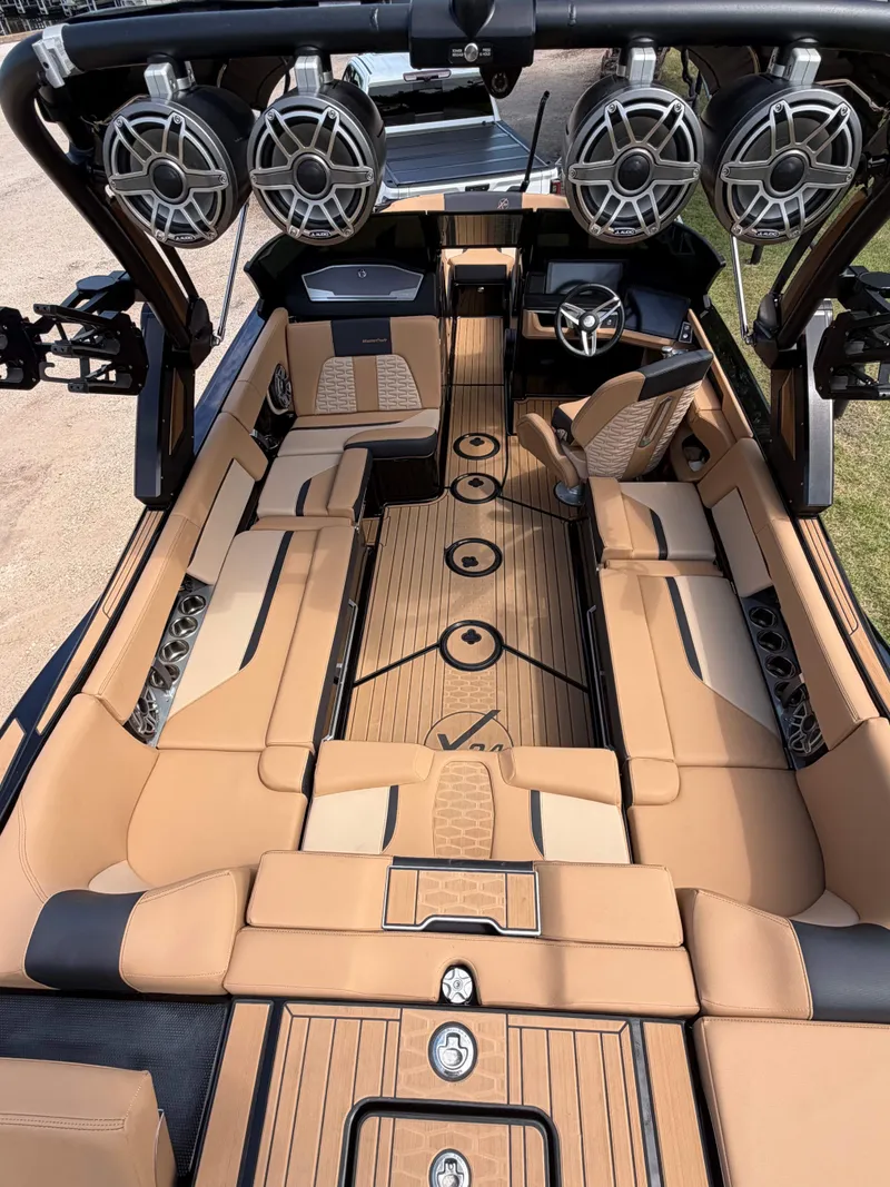 Slide: The Image of The image shows the interior of a 2025 MasterCraft X24 with luxurious leather seating and modern design. - 5