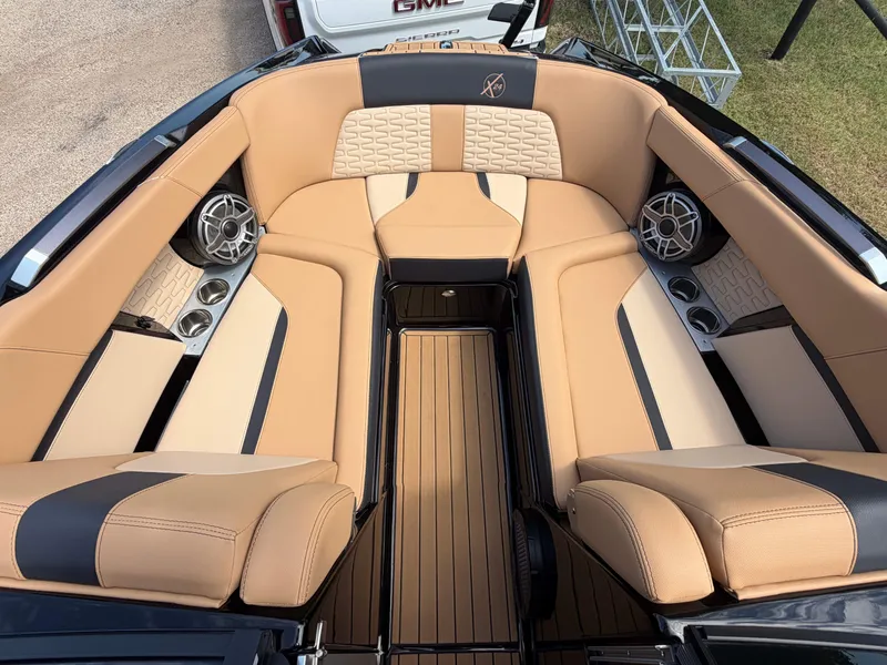 Slide: The Image of The image shows the interior of a 2025 MasterCraft X24 with luxurious beige upholstery. - 11