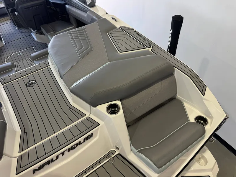 Slide: The Image of The image shows the gray upholstery of a 2022 Nautique Super Air Nautique G21. - 11