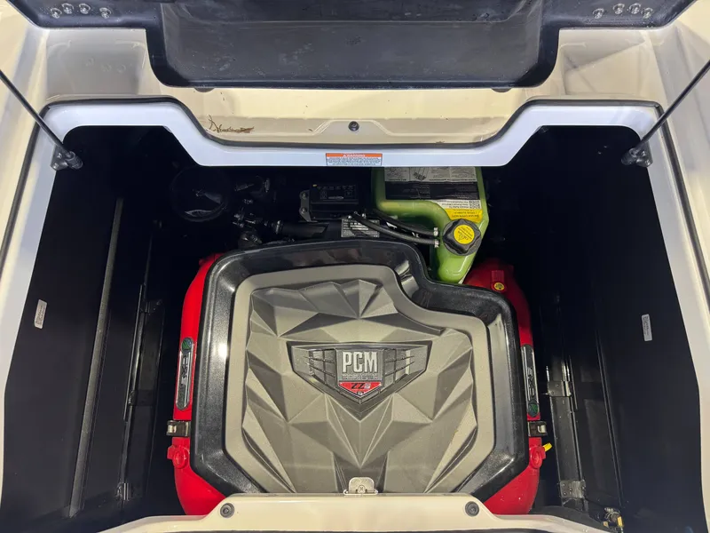 Slide: The Image of The engine compartment of a 2022 Nautique Super Air Nautique G21 with a PCM engine is visible. - 27