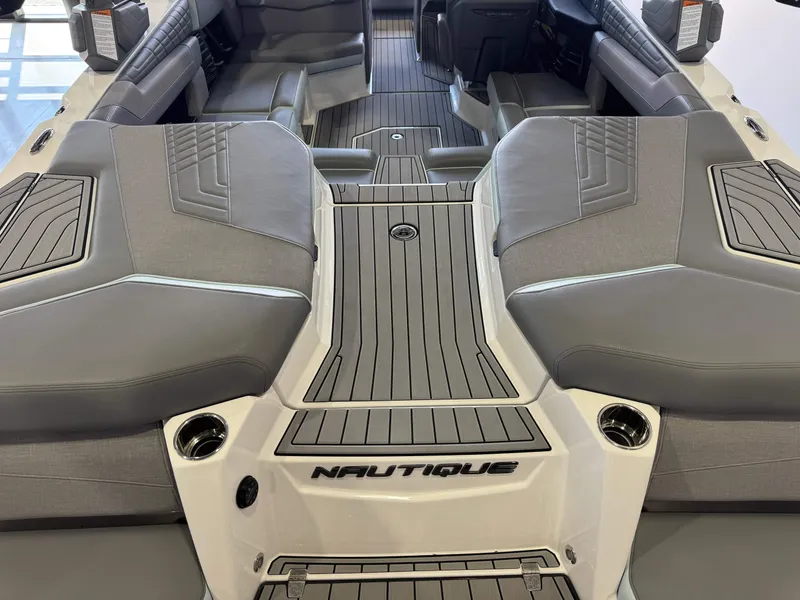 Slide: The Image of The image shows the stern of a 2022 Nautique Super Air Nautique G21 with gray upholstery. - 10