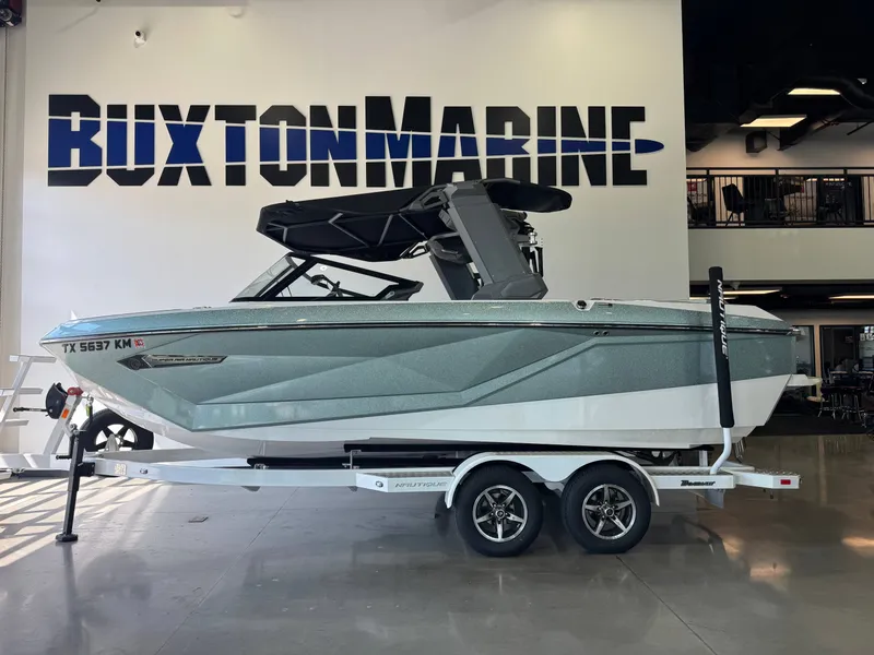 Slide: The Image of 2022 Nautique Super Air Nautique G21 on a trailer in a showroom. - 4