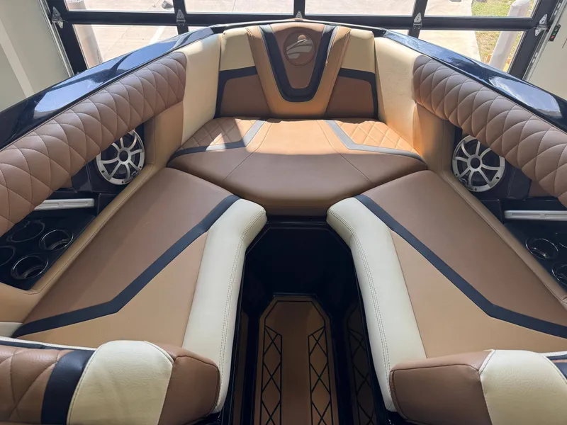 Slide: The Image of The image shows the luxurious interior of a 2021 Tigé 25ZX boat with elegant seating. - 16