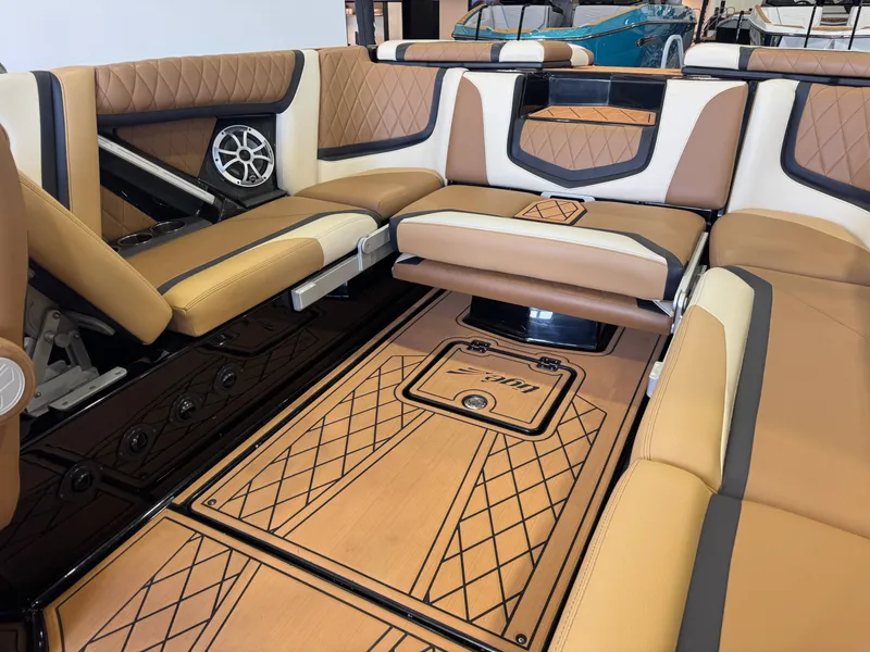 Slide: The Image of The image shows the luxurious interior of a Tigé 25ZX boat with elegant seating and stylish details. - 14
