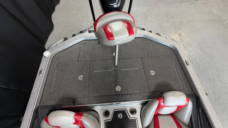 Slide: The Image of The image shows the cockpit of a 2015 Ranger Tugs Z520C with gray and red seats. - 17