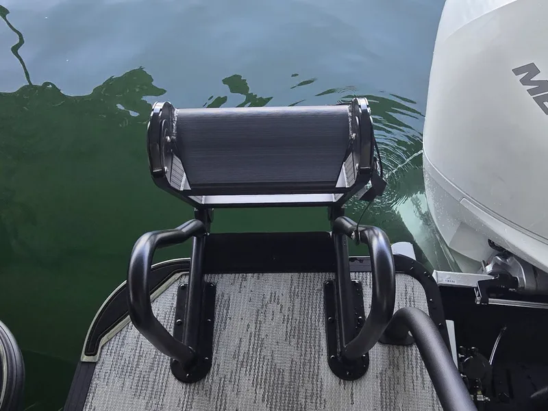 Slide: The Image of A swim ladder at the stern of a boat in the water, with an engine beside it. - 8