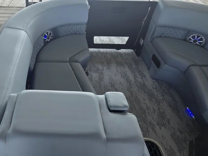 Slide: The Image of The image shows the interior of a 2027 Sylvan G-3 SLZ with gray upholstered seating. - 29