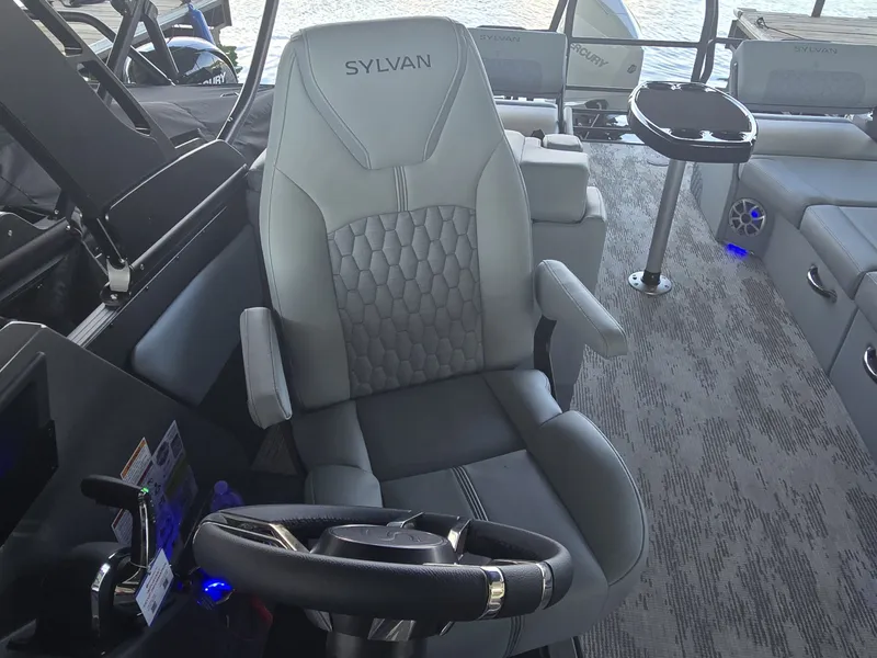 Slide: The Image of The 2027 Sylvan G-3 SLZ features a luxurious captain's chair with gray upholstery and armrests. - 22