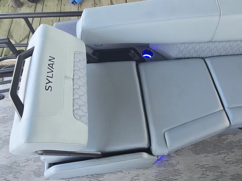 Slide: The Image of The image shows a modern, upholstered seat on a boat with the word "SYLVAN." - 14