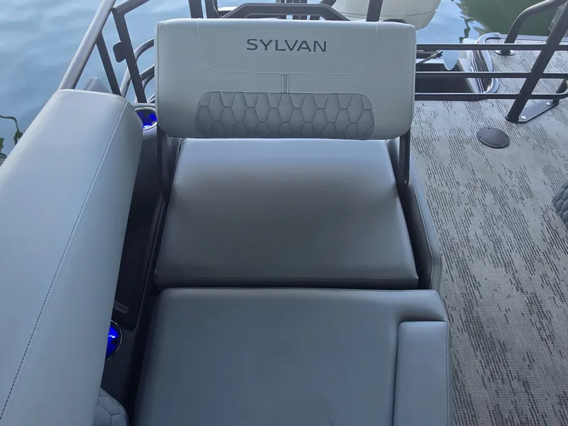 Slide: The Image of The image shows a seating area on a Sylvan G-3 SLZ boat with gray upholstery. - 13