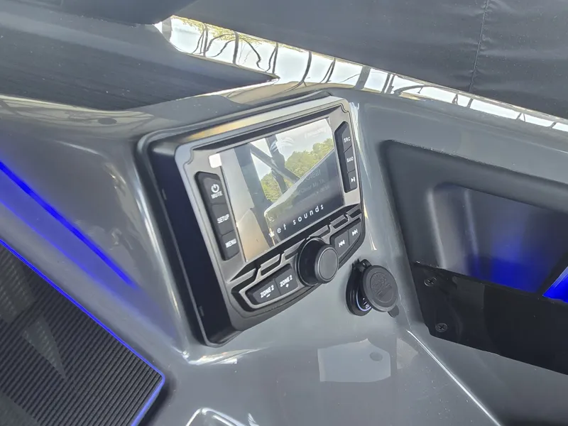 Slide: The Image of The image shows a modern boat panel with a built-in sound system and blue LED lighting. - 26