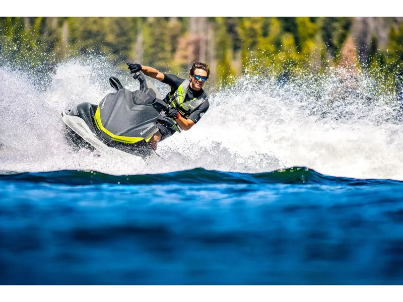 Slide: The Image of A rider on a 2026 Kawasaki Jet Ski® ST® 160X navigating through splashing water. - 20