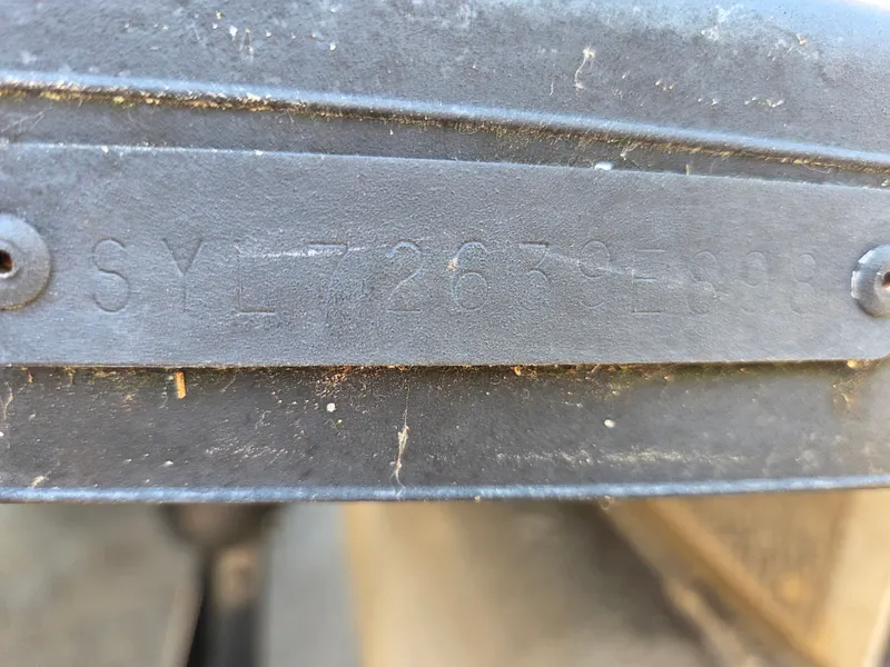 Slide: The Image of Close-up of a serial number on a 1998 Sylvan 826 Nexus boat. - 25