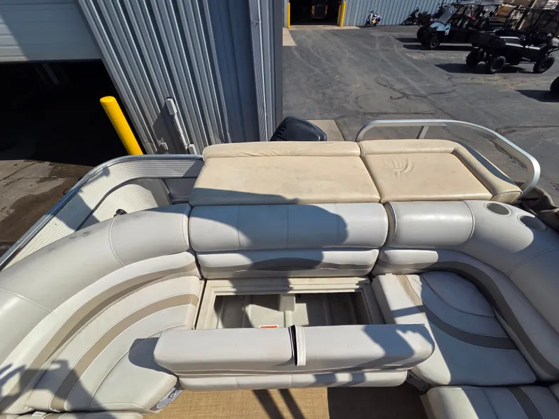 Slide: The Image of The image shows the deck of a 1998 Sylvan 826 Nexus with cushioned seating. - 22