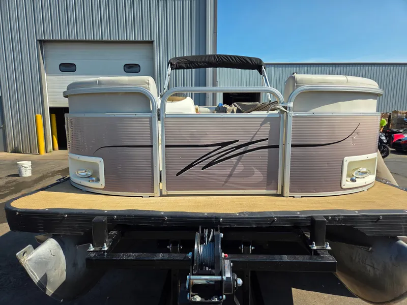 Slide: The Image of A 1998 Sylvan 826 Nexus pontoon boat on a trailer in front of a building. - 8