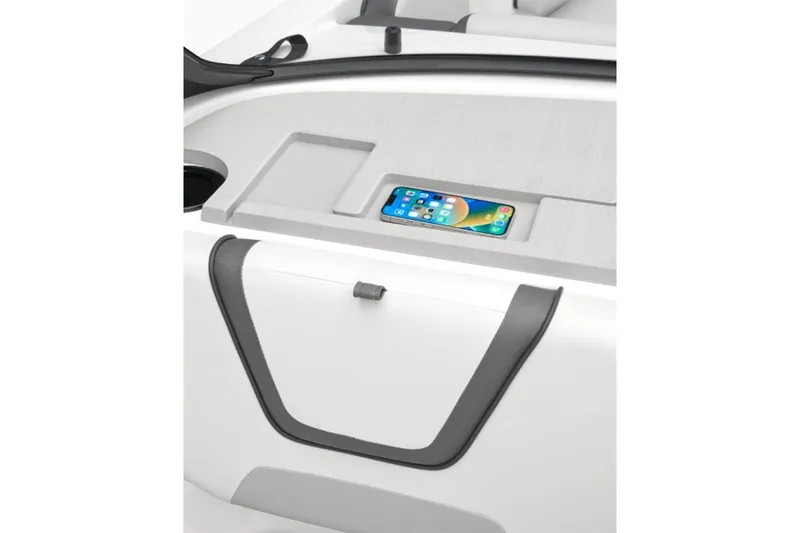 Slide: The Image of A modern boat cockpit with a smartphone in a compartment. Sleek, minimalist design. - 4