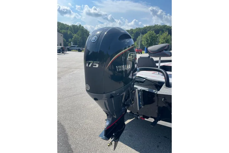 Slide: The Image of Yamaha 175 outboard motor on 2027 Xpress H20 Bass boat, parked outdoors. - 10