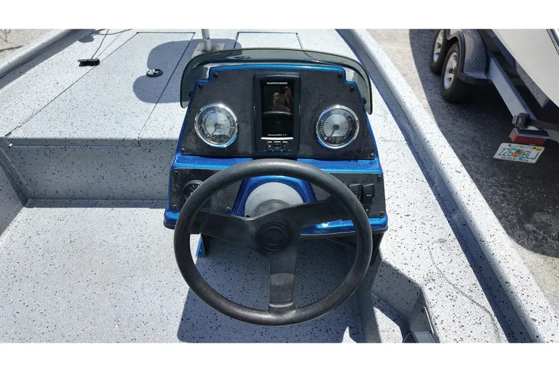 Slide: The Image of Steering console of 2016 Xpress XP7 boat with gauges and controls. - 10