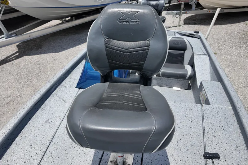 Slide: The Image of 2016 Xpress XP7 boat seat with logo, featuring gray and black upholstery. - 8