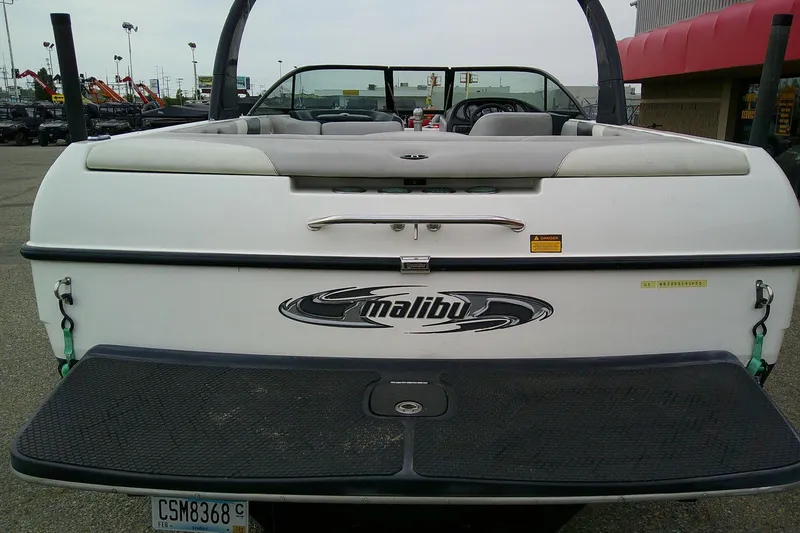 Slide: The Image of 2005 Malibu iRide boat rear view with logo and swim platform. - 11